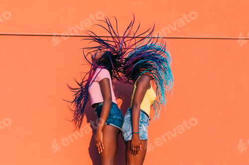 Preview: two women sisters dancing moving hair outdoor
