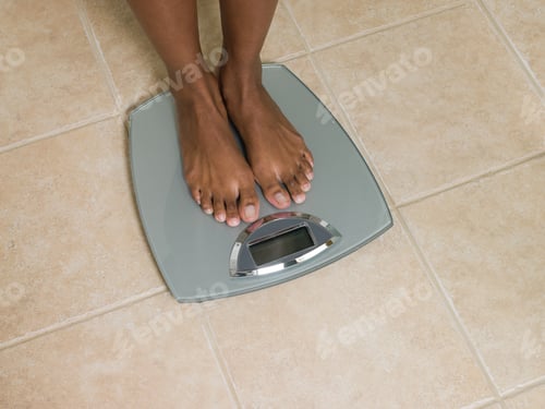 Preview: Feet of woman on scales