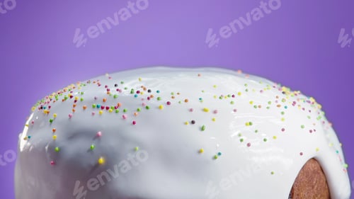 Preview: Easter cake decoration with colorful decorative sprinkles on violet background