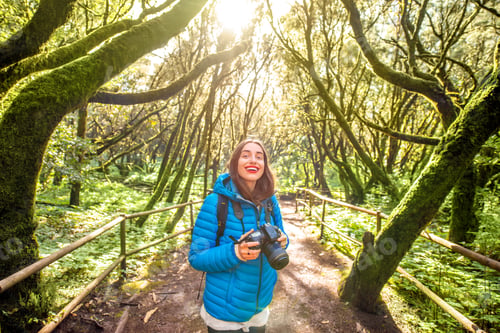 Preview: Woman traveling evergreen forest