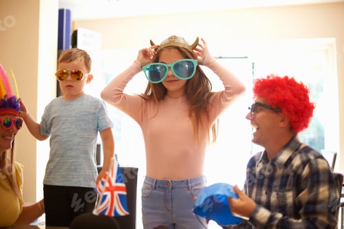 Preview: Family playing dress up, wearing funny hats and glasses, laughing