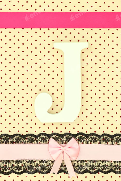 Preview: Wooden letter J on polka dots background