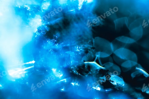 Preview: Macro shot of melting snow flowing on a windscreen