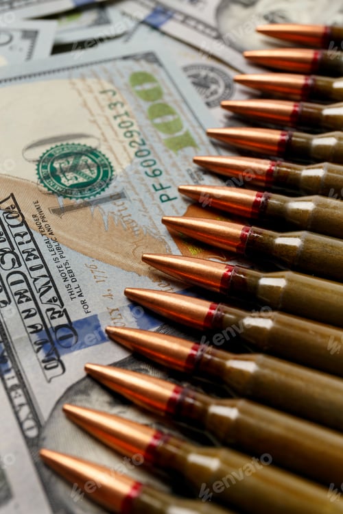 Preview: Bullets lie on American dollar bills, arms trade