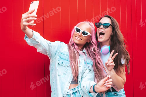 Preview: Two beautiful women posing outdoors