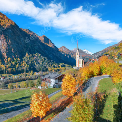 Preview: Amazing autumn landscape at Heiligenblut with St Vincent Church near Grossglockner mount .