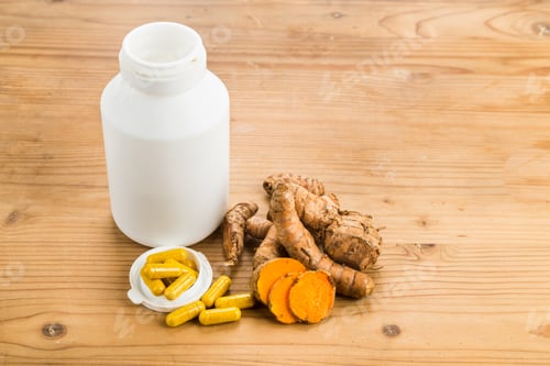 Preview: Homemade turmeric capsule from freshly grounded turmeric roots.