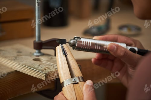 Preview: Jeweler working with wooden tools