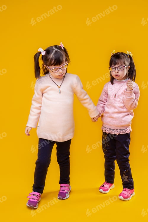 Preview: Standing Under Lights. Dark-Haired Pretty Girls With Down Syndrome And Unusual Face Features