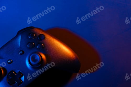 Preview: Gaming joystick on black background in neon light