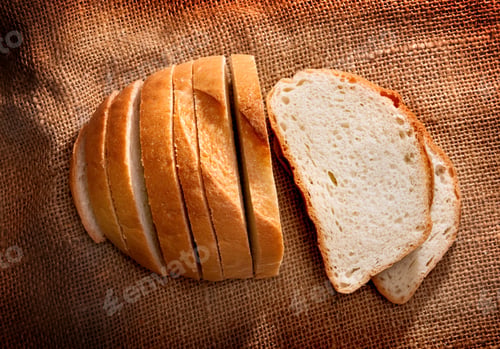 Preview: Pieces of bread on brown fabric