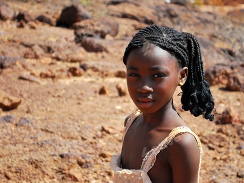 Preview: little girl posing for picture in the desert - sand family eyes innocence girl