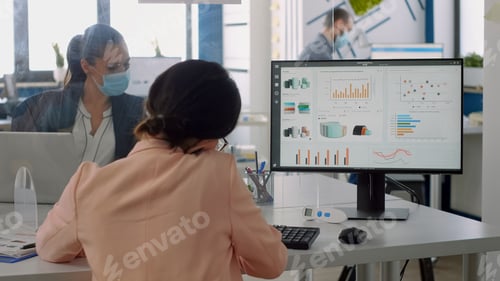 Preview: Business woman talking at phone with partners while team working in background
