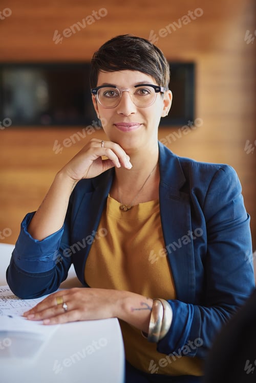Preview: Confident Business Woman at Office Meeting Table