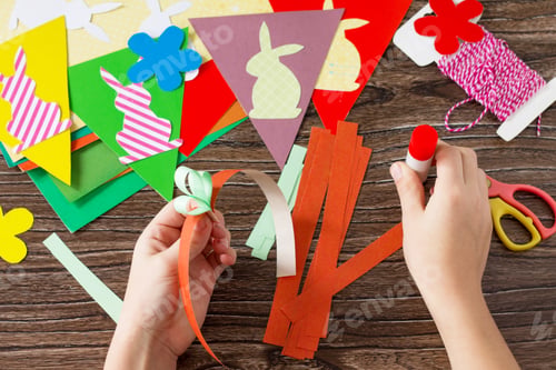 Preview: Festive Easter garland handmade with decoration of colorful rabbits and carrot.