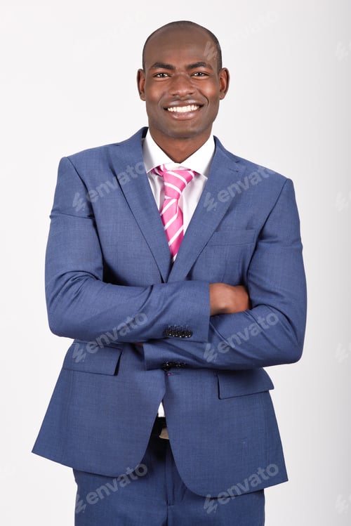 Smiling Man in a Blue Suit with Pink Tie