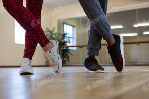 Preview: Low section of friends practicing dance on floor
