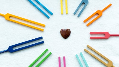 Preview: Set of colorful tuning forks like sun rays with heart symbol