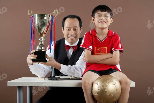 Preview: Father And Son Smiling, Father Holding Trophy