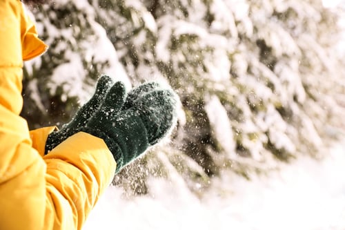 Preview: Woman playing with snow outdoors, closeup. Winter vacation