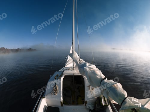 Preview: Beautiful shot of Olympus OM-D boat sailing in the morning with the sky in the background