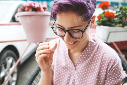Preview: Young hipster woman with purple hair.