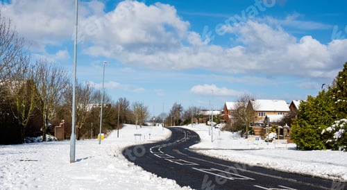 Preview: Winter landscape with snow covering the road in village,