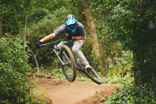 Preview: Mountain bike, man and jump in park for extreme sports, cycling competition and adventure of action