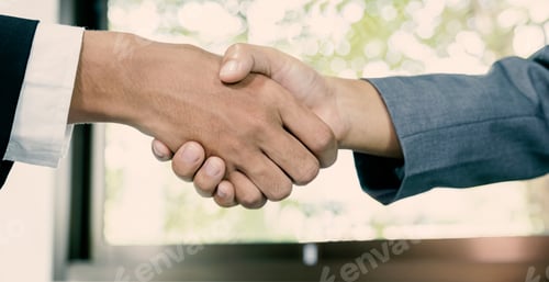 Preview: hands shake after business office executives are interviewing job applicants in the meeting room