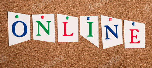 Preview: The word online is standing on paper pinned to a cork board, working digital, business and education