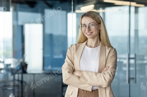 Preview: Confident businesswoman posing in modern office setting