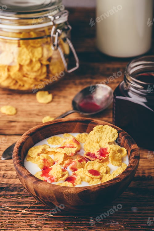 Preview: Breakfast with corn flakes, milk and berry syrup