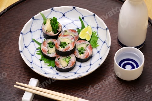 Preview: A Japanese sushi restaurant roll dish of pickled sardines and ginger wrapped in nori seaweed.