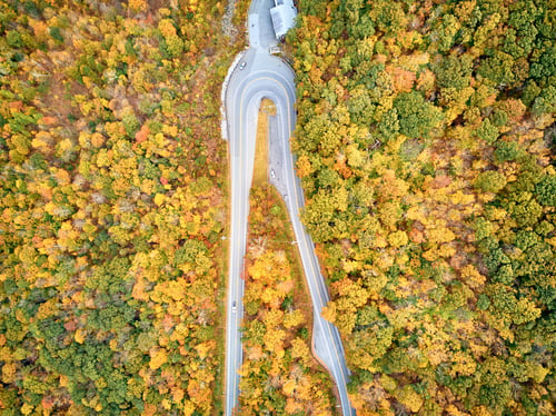 Preview: Scenic highway hairpin turn in autumn
