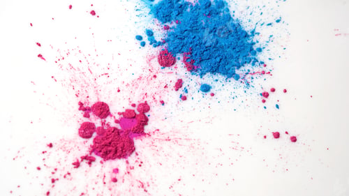Preview: Close-up of colorful spots on white liquid. Beautiful abstract background with colorful spots of dry