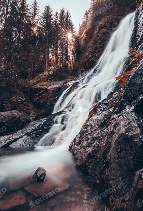 Preview: Long exposure of a waterfall in an autumn forest