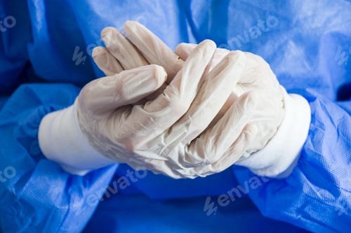 Preview: Closeup shot of doctor hands with sterile and disinfection white gloves and special uniform