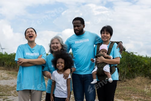 Preview: Family with daughter walking on field on wind farm.