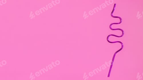 Preview: Colorful plastic cocktail straw on a pink background. Flat lay. Copy space