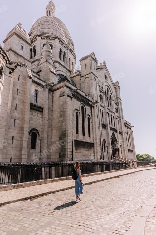 Preview: Woman walking in front of Sacre Coeur basilica