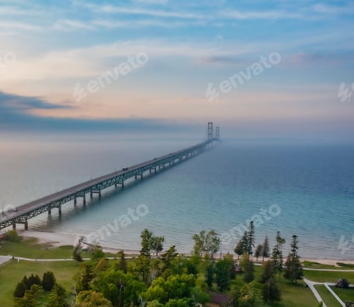 Preview: Mackinac bridge as the sun goes down over lake michigan