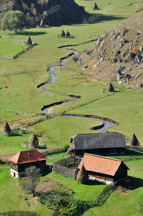 Preview: Autumn landscape with a small village in the mountains