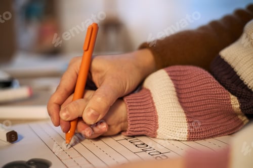 Preview: Child Practicing Handwriting with Mother during Learning Activity