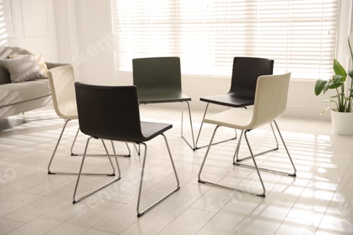 Preview: Chairs in circle prepared for group psychotherapy session indoors