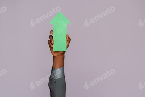 Preview: black man holding an arrow pointing upwards