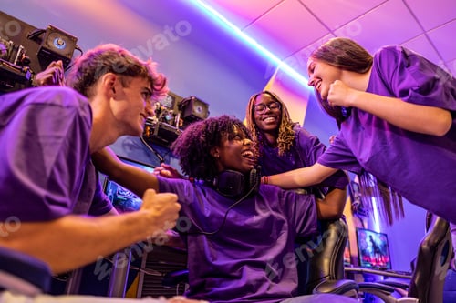 Preview: Team of multiracial professional cyber sports players celebrating success.