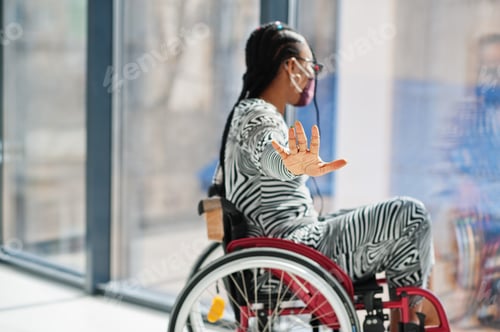 Preview: Adult in Wheelchair Looking Out Window