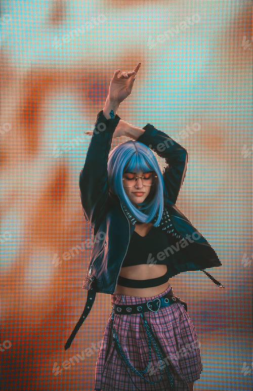 Preview: Image of a beautiful young woman posing against a led panel.