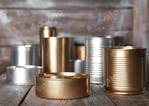 Preview: Many tin cans on table. Recycling garbage