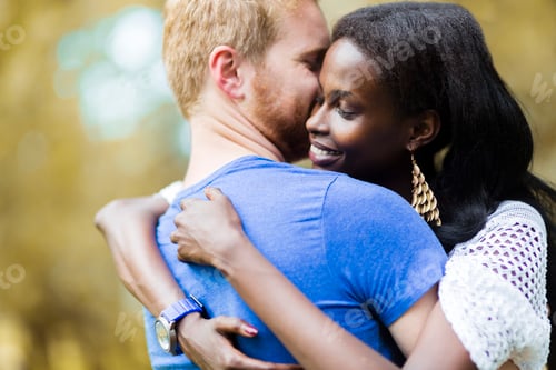 Preview: Couple in love hugging and kissing peacfully outdoors